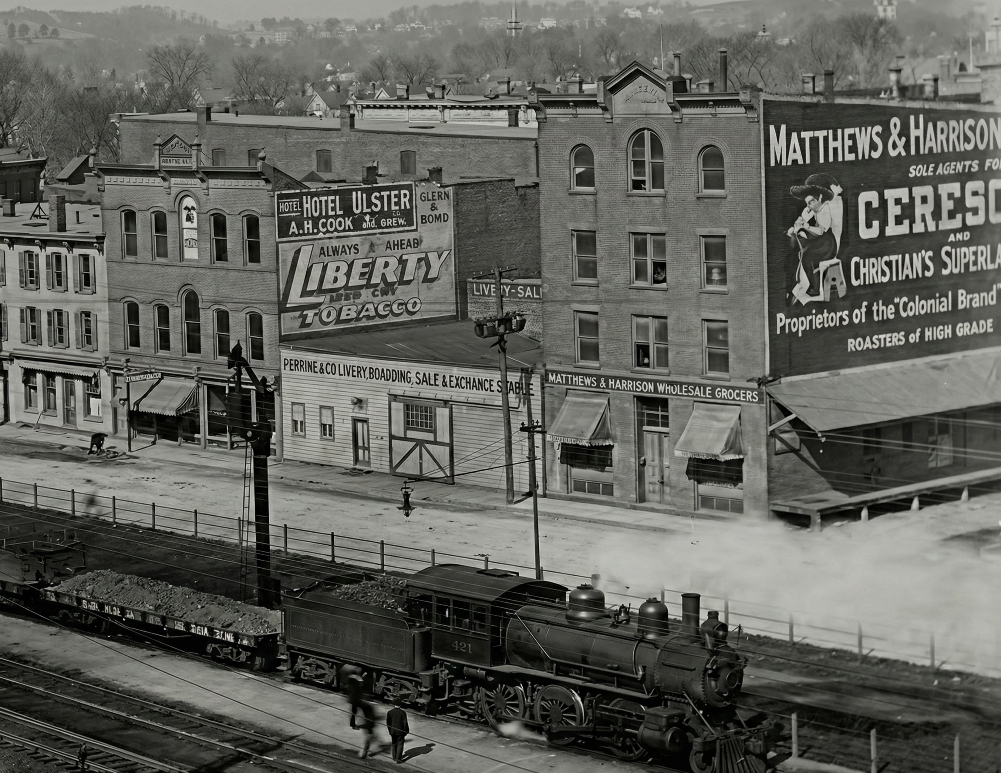 Steam locomotive on Railroad Avenue, Matthews & Harrison mural beyond